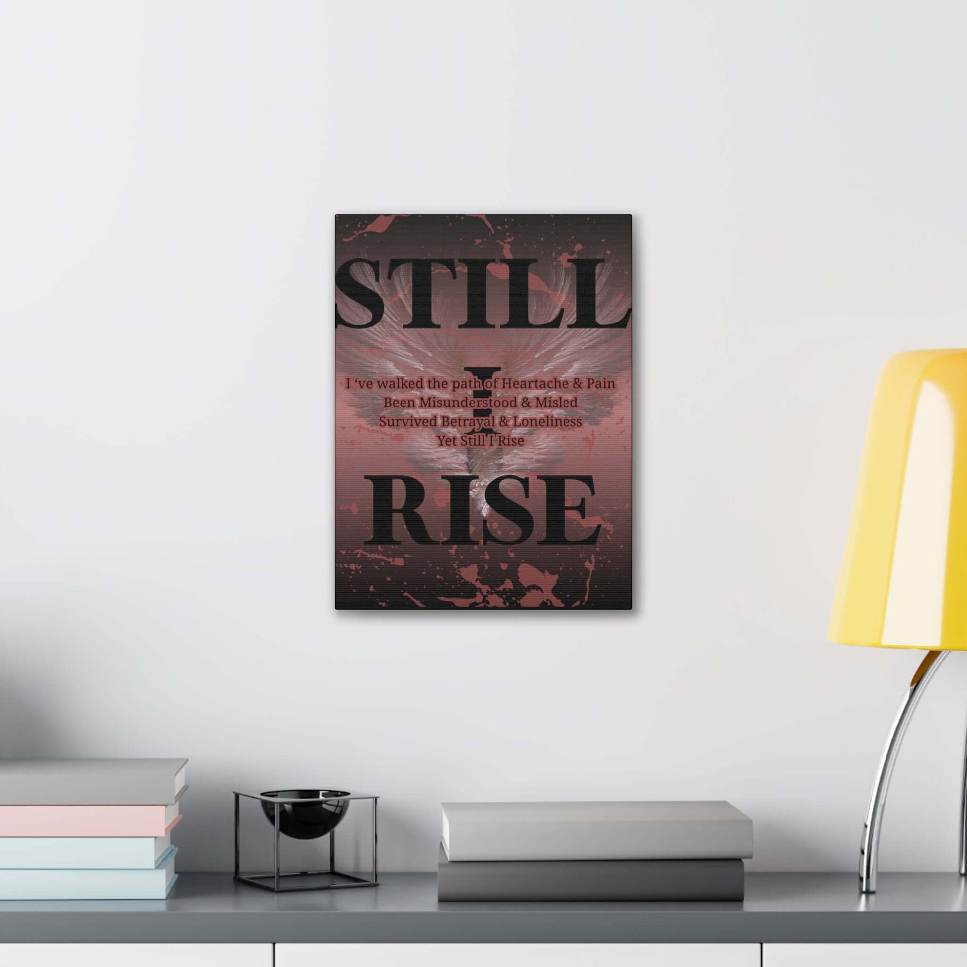 Still I Rise personalized wall art displayed in a modern setting with a lamp and books.